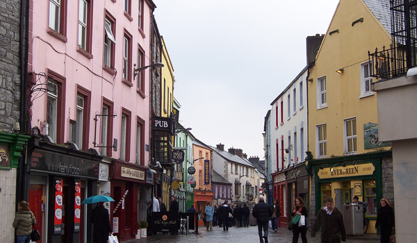 People stroll through Main Street in Galway City