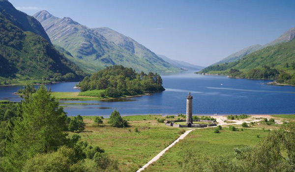 The Glenfinnan Highlands with commemorative Glenfinnan Monument in foreground.