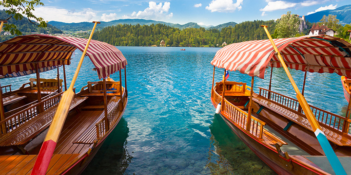 Traditional wooden boats on picture perfect lake Bled, Slovenia.