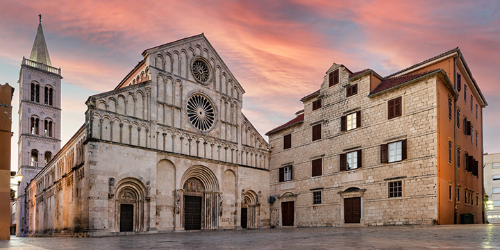 panoramic view of the facade of the Cathedral of St. Anastasia at sunrise in Zadar, Croatia 