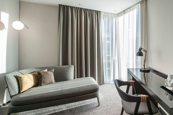 standard-room-sofa-pillows-workdesk-window-clarion-hotel-stockholm