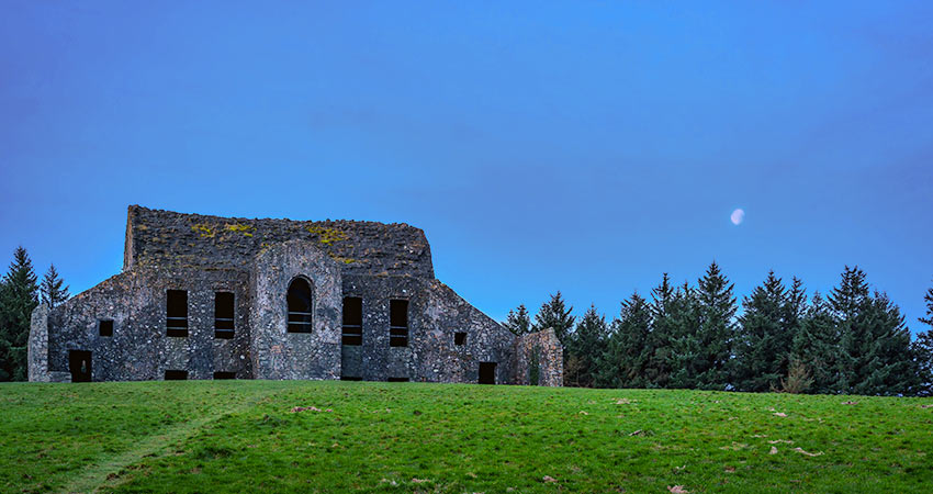 Ruins of the Hell Fire Club atop Montpelier Hill in Ireland at dusk