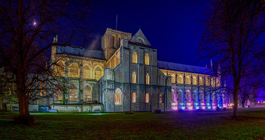 Winchester Cathedral illuminated at night in England