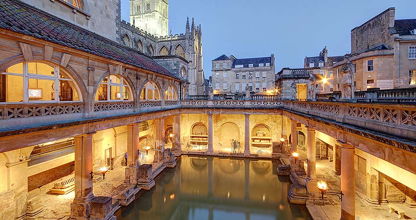The Roman Baths in Bath, England illuminated at twilight