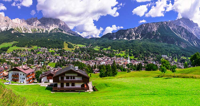 Town of Cortina d'Ampezzo in Italy during summer showing dolomite mountain range in the background