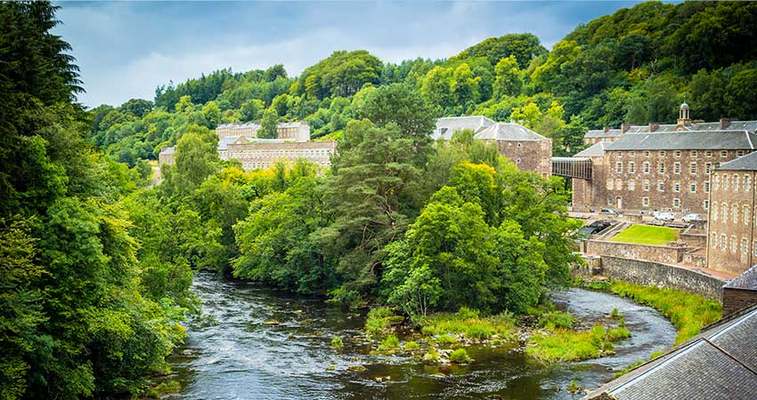 View of the New Lanark mills situated on an appealing gorge by the River Clyde