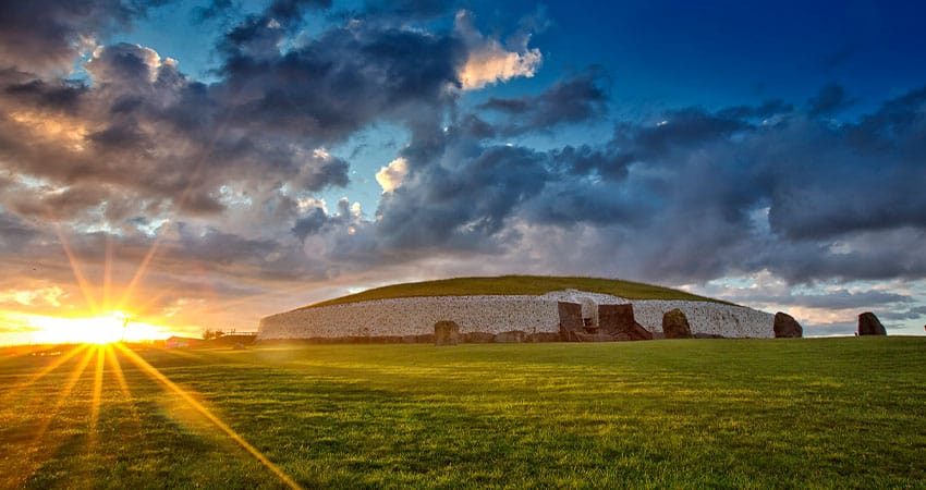 Newgrange prehistoric monument in County Meath in Ireland during sunset