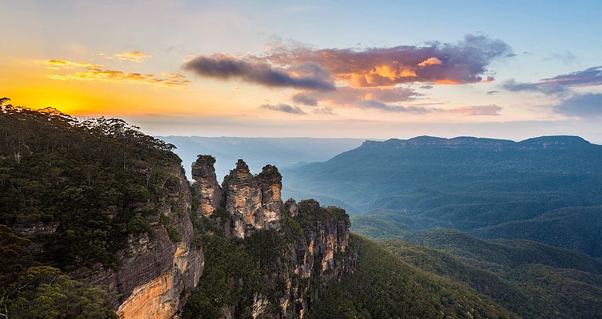 Sunrise from Echo Point showing the three sisters rock formations in Blue Mountains Australia