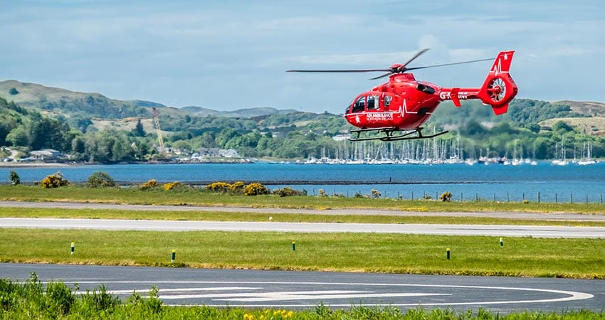 Scottish rescue helicopter taking flight in tourist vacation area