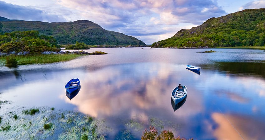 Image of a lake in Killarney with small wooden boats